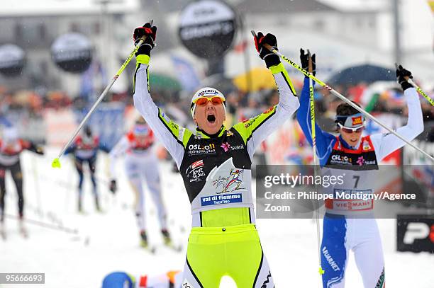 Petra Majdic of Slovenia celebrates taking 1st place during the Women's 10km Classic Mass Start of the FIS Tour De Ski on January 9, 2010 in Val di...