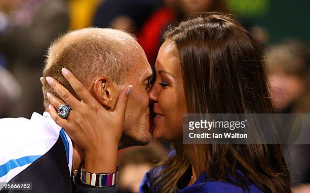 Nikolay Davydenko of Russia kisses his wife Irina Davydenko following his victory over Rafael Nadal of Spain during the Final match of the ATP Qatar...