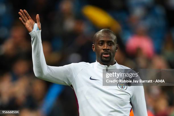 Yaya Toure of Manchester City waves to the fans after his final appearance for the club during the Premier League match between Manchester City and...