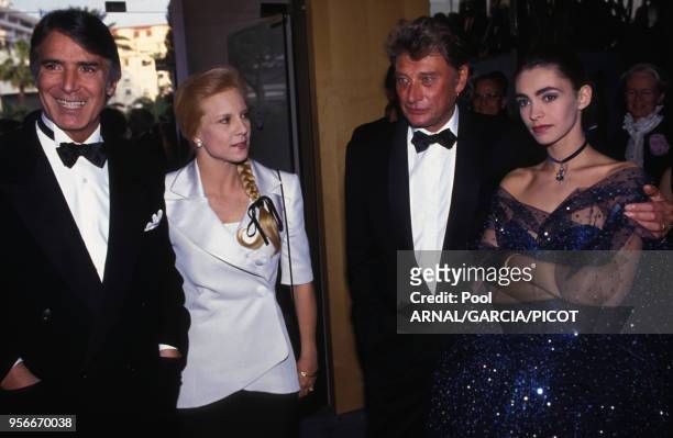 Tony Scotti, Syvie Vartan, Johnny Hallyday et Adeline Blondieau au Festival de Cannes en mai 1992, France.