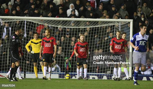 Wes Brown, Paul Scholes and Darren Fletcher of Manchester United show their disappointment at conceding a goal during the FA Barclays Premier League...