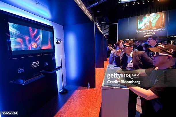 Attendees wear 3-D glasses while looking at a Panasonic Corp. Viera 3-D television during the 2010 International Consumer Electronics Show in Las...
