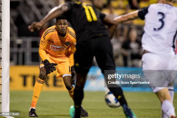 Philadelphia Union goalkeeper Andre Blake focuses on the ball as Philadelphia Union defender Jack Elliott pushes Columbus Crew forward Gyasi Zerdes...