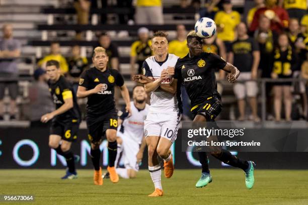 Columbus Crew forward Gyasi Zerdes heads the ball Philadelphia Union midfielder Borek Dockal defends in the MLS regular season game between the...