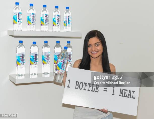 Laci Kay with Sababa water wearing Moonstar Beauty make-up at The Artists Project Giveback Day at The Artists Project on May 9, 2018 in Los Angeles,...