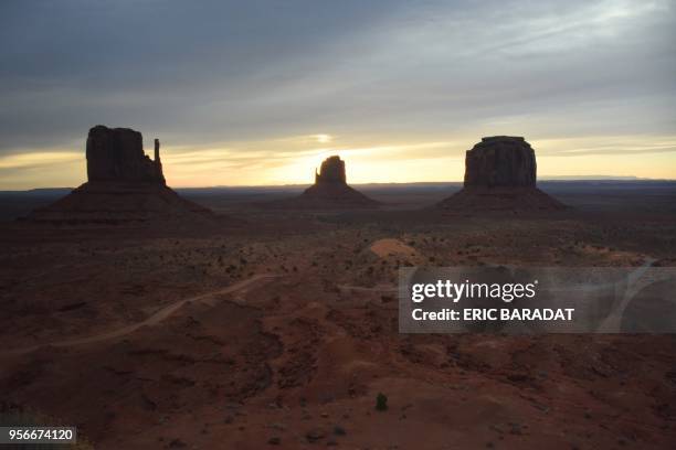 The sun rises over the Monument Valley on April 19, 2018. Monument Valley is a region of the Colorado Plateau characterized by a cluster of vast...