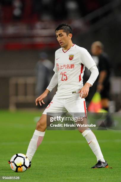 Odil Ahmedov of Shanghai SIPG in action during the AFC Champions League Round of 16 first leg match between Kashima Antlers and Shanghai SIPG at...