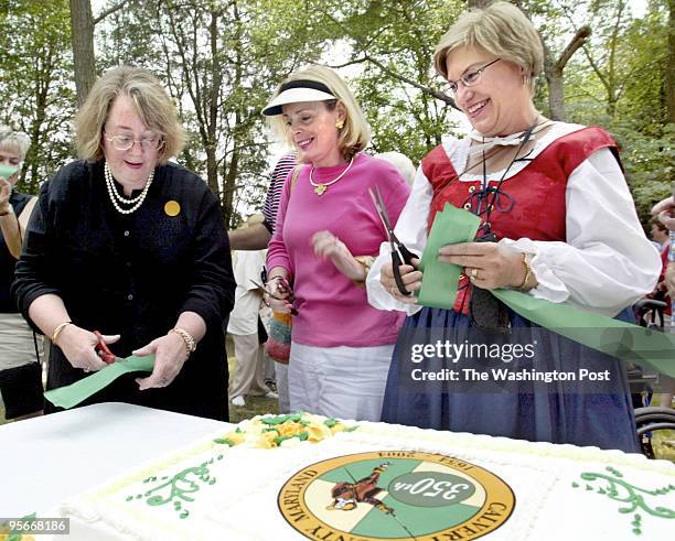 Louisa Goldstein daughter of the late Louis L. Goldstein, state comptroller of Maryland, cuts a piece of ribbon for a keepsake after the cutting...