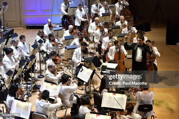 Conductor Keith Lockhart leads the Boston Pops Orchestra in a Leonard Bernstein Centennial Tribute for the orchestra's opening night concert on May...