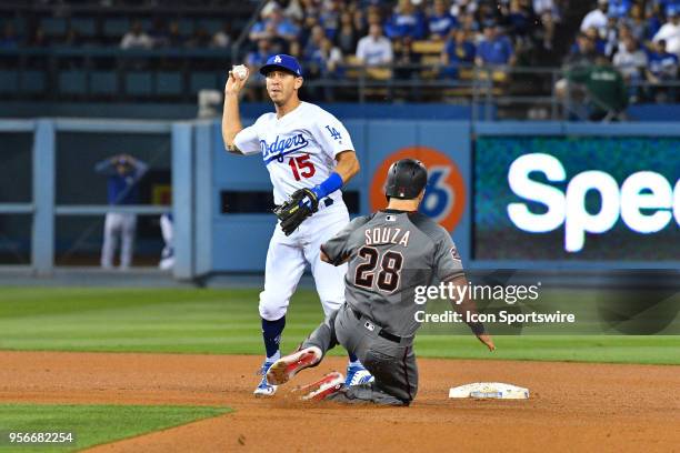 Arizona Diamondbacks right fielder Steven Souza Jr. Slides into Los Angeles Dodgers second baseman Austin Barnes as he turns the double play during a...