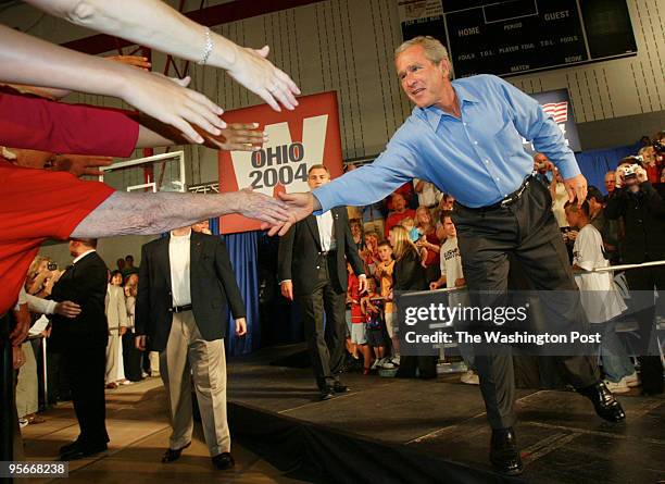 On the campaign trail with Republican candidate President George W. Bush, who has come to Lima, Ohio, for an "Ask President Bush" meeting. Pictured,...