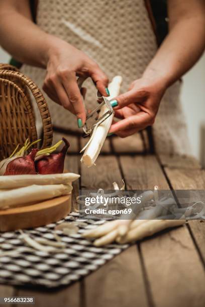 peeling white asparagus - asparagus stock pictures, royalty-free photos & images