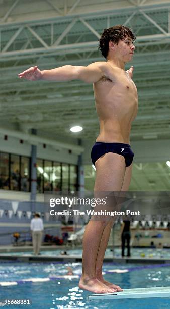 Matt Cooper, of the St. Albans dive team, shows off a reverse dive while practicing at the Montgomery Aquatic Center.