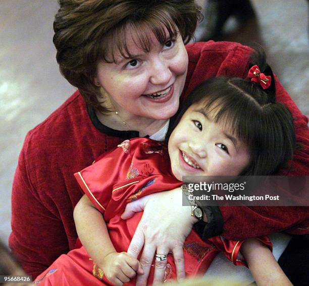 Families with adopted children from China gather for their annual New Year's Day celebration. PICTURED, Lana Harrison and her daughter Elaina Ming...