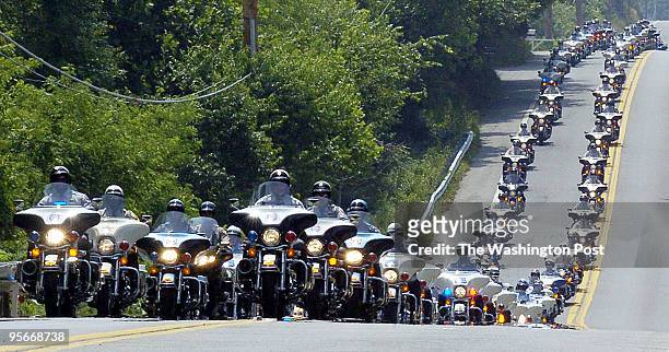 Hundreds of motorcycle police participate in the services for slain Prince George's County Police Officer Cpl. Steve Gaughan as they ride down...