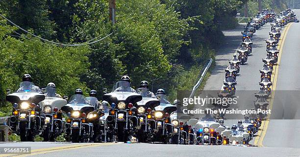 Hundreds of motorcycle police participate in the services for slain Prince George's County Police Officer Cpl. Steve Gaughan as they ride down...