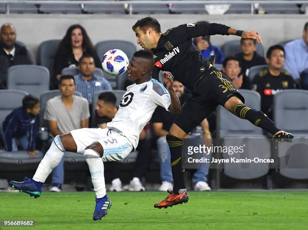 Dejan Jakovic of Los Angeles FC and Jerome Thiesson of Minnesota United collide as the go for the ball in the second half of the game at Banc of...