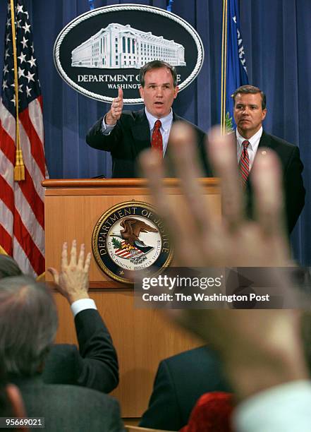 Special Counsel Patrick J. Fitzgerald, top left, and SAC Philadelphia Jack Eckenrode announce their grand jury findings at a press conference at the...