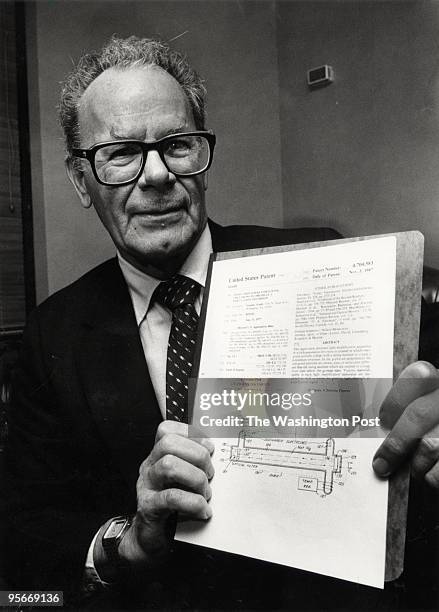 Dr. Gordon Gould, who recently won a 30-year legal battle for the patent of the laser. Here, Gould with his patent which he received from Sen. Arlen...