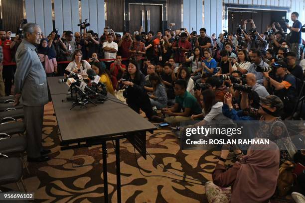 Former Malaysian prime minister and winning opposition candidate Mahathir Mohamad speaks to journalists during a press conference in Kuala Lumpur on...