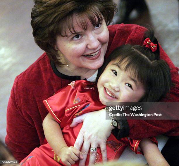 Families with adopted children from China gather for their annual New Year's Day celebration. PICTURED, Lana Harrison and her daughter Elaina Ming...