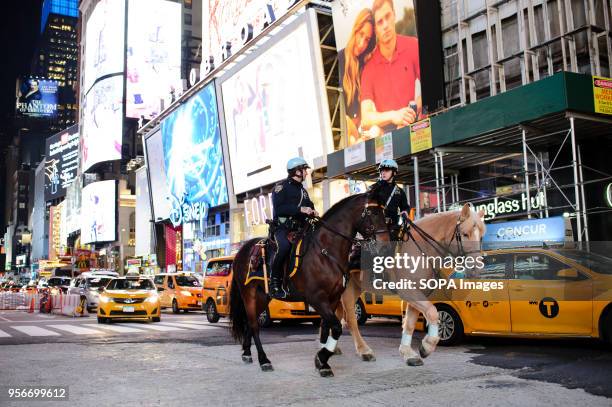 Mounted police patrol Times Square after dark on Election Day. Both Donald Trump and Hillary Clinton are holding election night events in Manhattan...