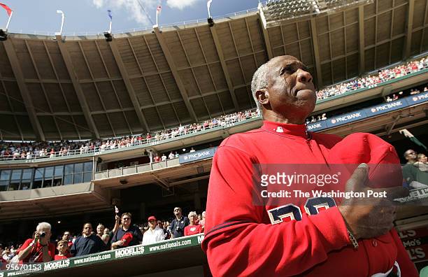 Washington Nationals manager Frank Robinson tears up during the singing of the National Anthem before his last game as manager at RFK Stadium on...