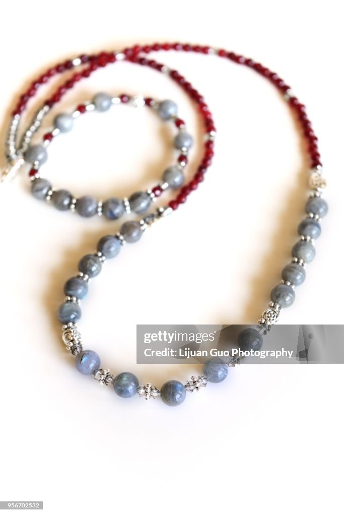 Labradorite and wine red garnet gemstone necklace isolated on white background