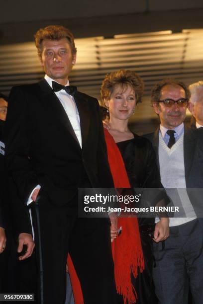 Johnny Hallyday, Nathalie Baye et Jean-Luc Godard lors du 38ème festival de Cannes le 11 mai 1985, France.