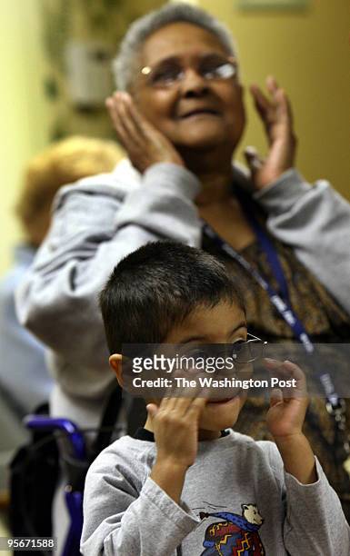 Preschoolers from the Judy Center at Summit Hall Elementary with senior citizens at Forest Oak Tower, an apartment complex for the elderly. The Judy...
