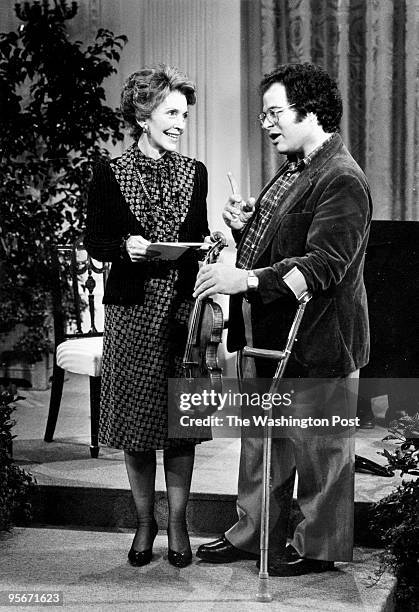 Nancy Reagan with Itzhak Perlman rehearsing in the East Room of the White House on .