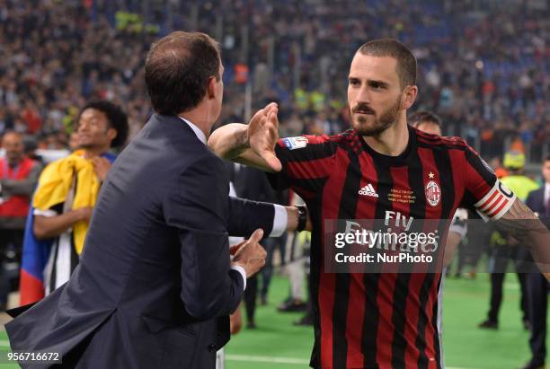 Leonardo Bonucci greets Massimiliano Allegri after the Tim Cup Final football match F.C. Juventus vs A.C. Milan at the Olympic Stadium in Rome, on...