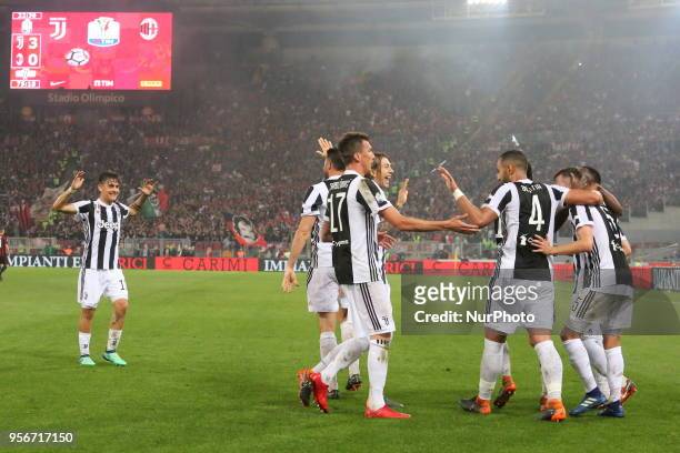 Juventus players celebrate after the own goal of Nikola Kalinic during the Italian Cup final match between Juventus FC and AC Milan at Stadio...