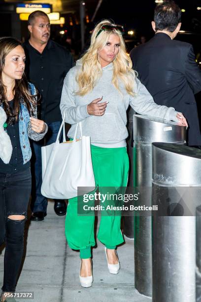 Jessica Simpson and Eric Johnson are seen at JFK Airport on May 9, 2018 in New York, New York.