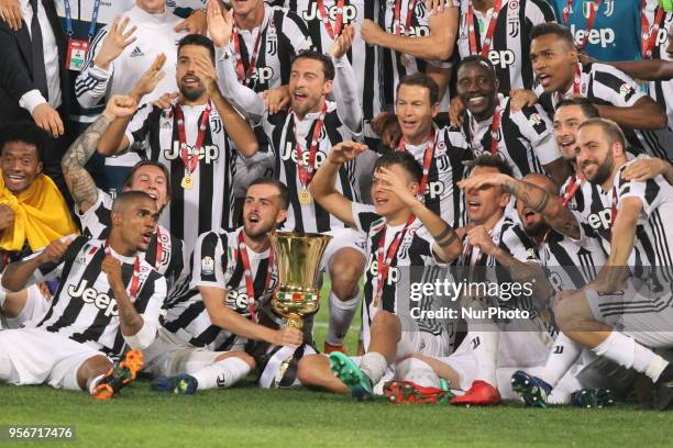 Juventus players celebrate the Italian Cup win after the final match against Milan at Stadio Olimpico on May 09, 2018 in Rome, Italy. Juventus won...