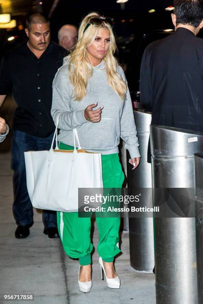Jessica Simpson and Eric Johnson are seen at JFK Airport on May 9, 2018 in New York, New York.