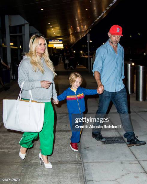 Jessica Simpson and Eric Johnson are seen at JFK Airport on May 9, 2018 in New York, New York.