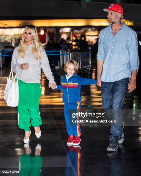 Jessica Simpson and Eric Johnson are seen at JFK Airport on May 9, 2018 in New York, New York.