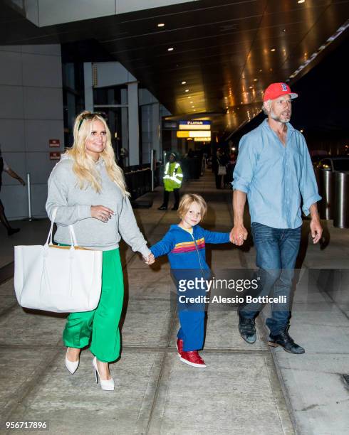 Jessica Simpson and Eric Johnson are seen at JFK Airport on May 9, 2018 in New York, New York.