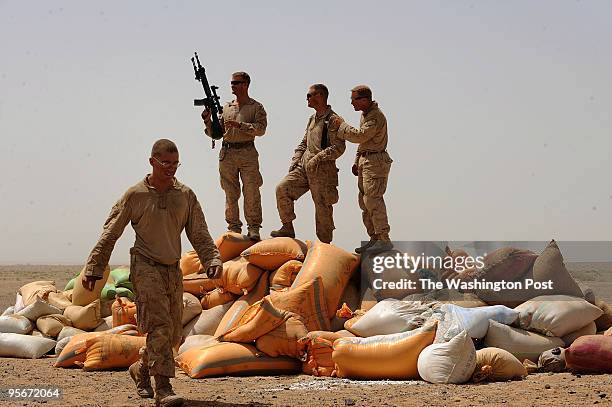 Marines from left to right, Lance Cpl. Nathan Dunlap, of Ohio, Major Steve Sutey, Battalion Operations Officer, Charlie Company Commanding Officer...