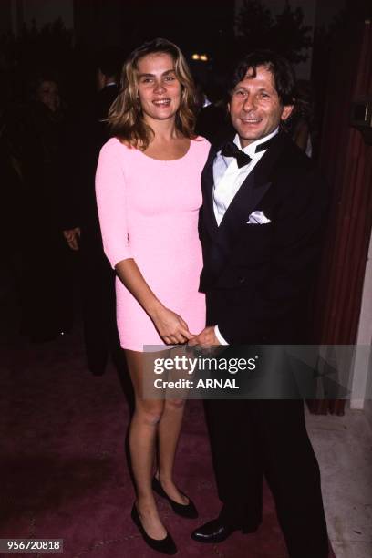 Roman Polanski et Emmanuelle Seigner lors d'une soirée à Paris en octobre 1988, France.