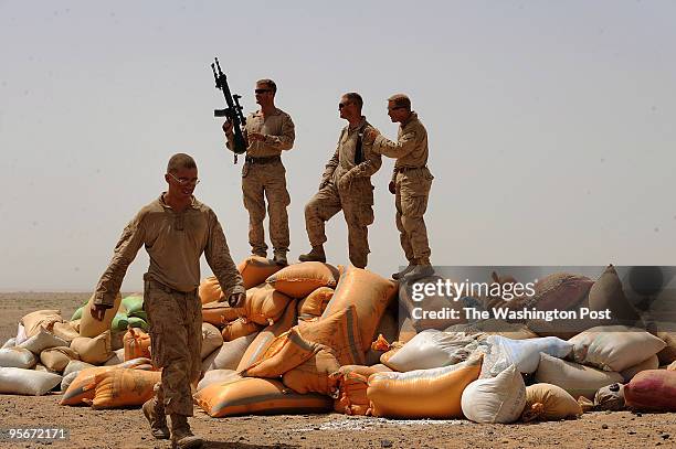 Marines from left to right, Lance Cpl. Nathan Dunlap, of Ohio, Major Steve Sutey, Battalion Operations Officer, Charlie Company Commanding Officer...