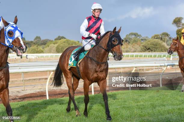 Jye McNeil returns to the mounting yard on Toorak Warrior after winning the Independent Cranes BM58 Handicap at Echuca Racecourse on May 10, 2018 in...