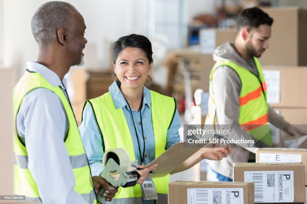 Distribution Associate Distribution Warehouse Employees Working Together High-Res Stock Photo ...
