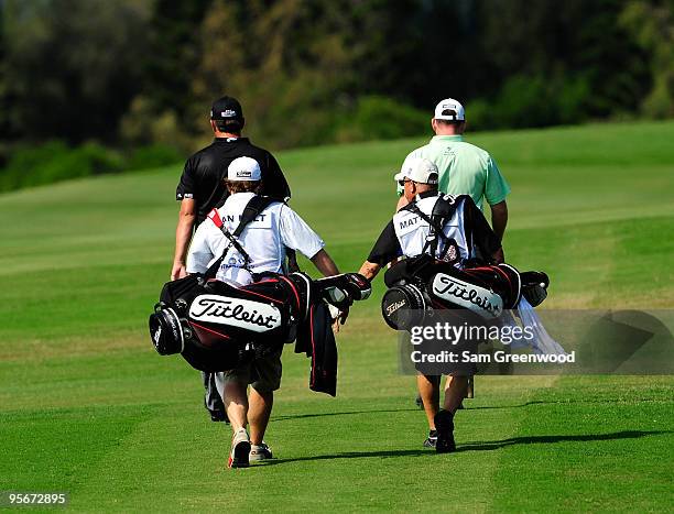 Bo Van Pelt and Troy Matteson walk down the 1st hole during the third round of the SBS Championship at the Plantation course on January 9, 2010 in...