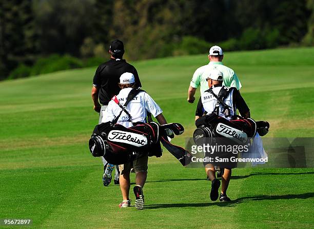 Bo Van Pelt and Troy Matteson walk down the 1st hole during the third round of the SBS Championship at the Plantation course on January 9, 2010 in...