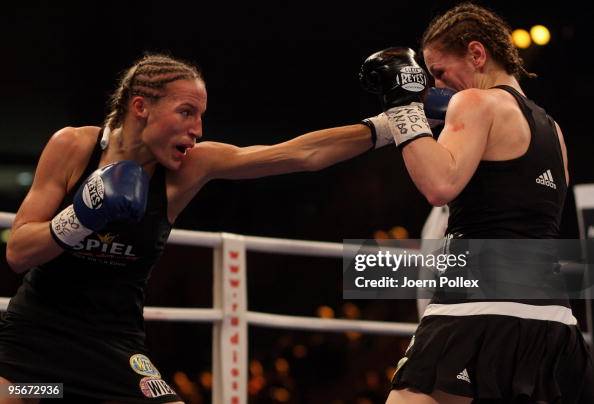 Boxing Ina Ina Menzer of Germany exchanges punches with Ramona Kuehne of Germany ...