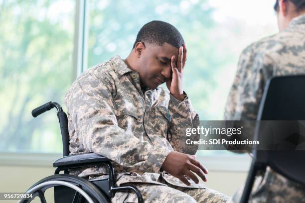 distraught injured military soldier - injured us army stock pictures, royalty-free photos & images