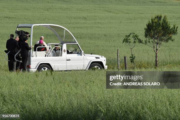 Pope FrancisPope Francis arrives on the popemobile for a pastoral visit in Nomadelfia, on May 10, 2018 near Grosseto, Tuscany.