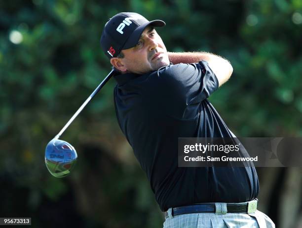 Angel Cabrera of Colombia hits a shot on the 1st hole during the third round of the SBS Championship at the Plantation course on January 9, 2010 in...